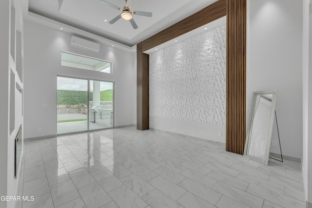 11345 Patricia Ave, El Paso, TX 79936 - spare room with a high ceiling, a wall mounted air conditioner, ceiling fan, and marble finish flooring