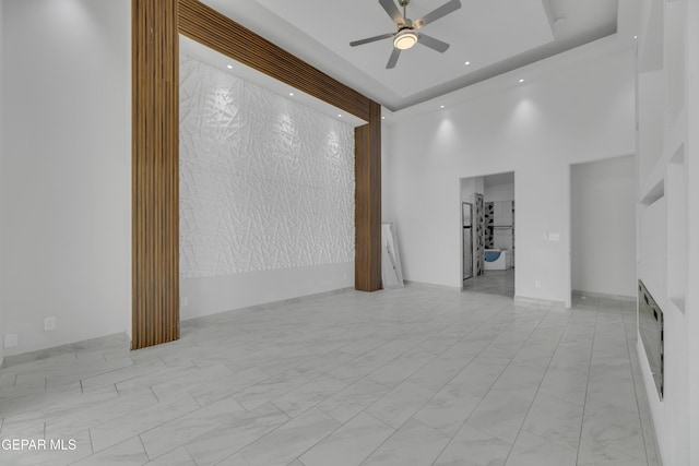 11345 Patricia Ave, El Paso, TX 79936 - unfurnished room featuring a ceiling fan, a towering ceiling, and marble finish flooring