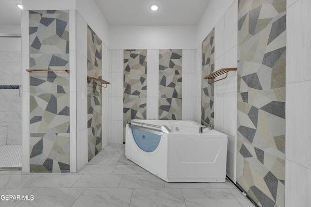 11345 Patricia Ave, El Paso, TX 79936 - washroom featuring marble look tile flooring, recessed lighting, and tile walls