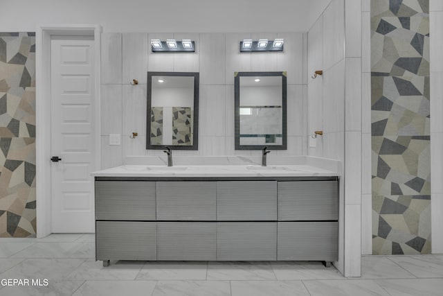 11345 Patricia Ave, El Paso, TX 79936 - full bath featuring marble finish floors, double vanity, and tiled shower