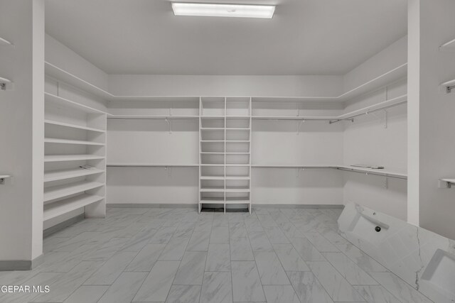 11345 Patricia Ave, El Paso, TX 79936 - walk in closet with marble look tiles