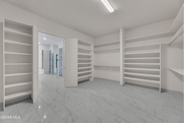 11345 Patricia Ave, El Paso, TX 79936 - walk in closet with marble finish floors
