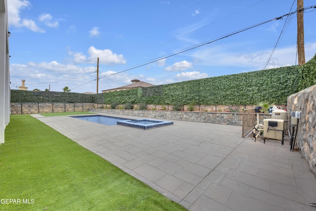 11345 Patricia Ave, El Paso, TX 79936 - view of pool with a patio area, a fenced backyard, and a pool with connected hot tub