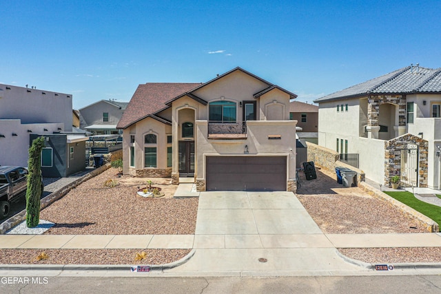 12616 Blazing Star Dr, El Paso, TX 79928 - view of front facade with stucco siding, an attached garage, and concrete driveway