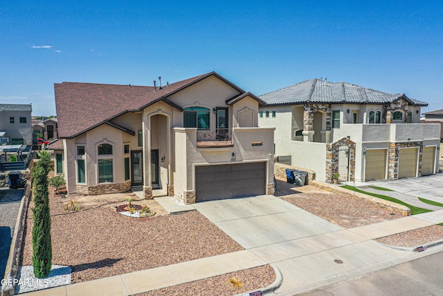 12616 Blazing Star Dr, El Paso, TX 79928 - view of front of property with stucco siding, a garage, stone siding, and concrete driveway