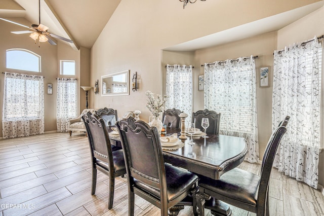 12616 Blazing Star Dr, El Paso, TX 79928 - dining space with high vaulted ceiling, a ceiling fan, and light wood-type flooring