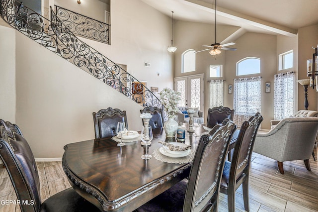 12616 Blazing Star Dr, El Paso, TX 79928 - dining space featuring a ceiling fan, stairway, high vaulted ceiling, and wood finish floors