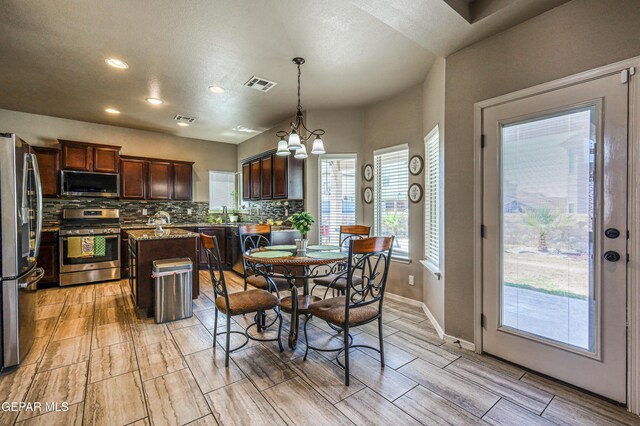 12616 Blazing Star Dr, El Paso, TX 79928 - dining space featuring recessed lighting, a chandelier, and wood finish floors