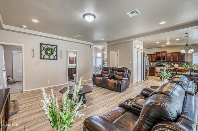 12616 Blazing Star Dr, El Paso, TX 79928 - living room with wood tiled floors and recessed lighting