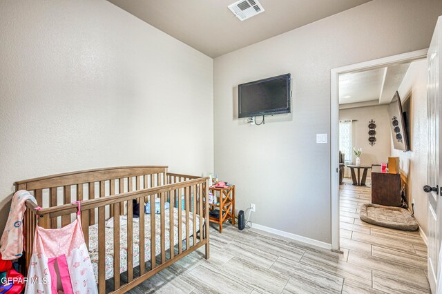 12616 Blazing Star Dr, El Paso, TX 79928 - bedroom with a nursery area and wood finish floors