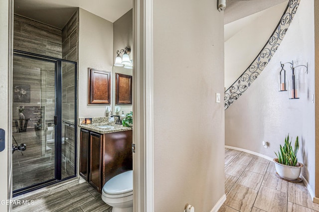 12616 Blazing Star Dr, El Paso, TX 79928 - full bath featuring a stall shower, vanity, and wood finish floors