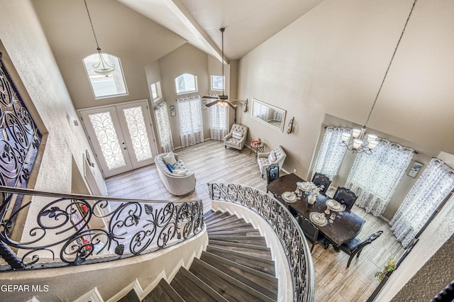 12616 Blazing Star Dr, El Paso, TX 79928 - foyer entrance featuring high vaulted ceiling, a chandelier, french doors, wood finished floors, and ceiling fan