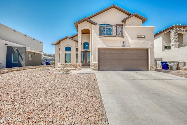 12616 Blazing Star Dr, El Paso, TX 79928 - view of front of house featuring stucco siding, a garage, driveway, and stone siding