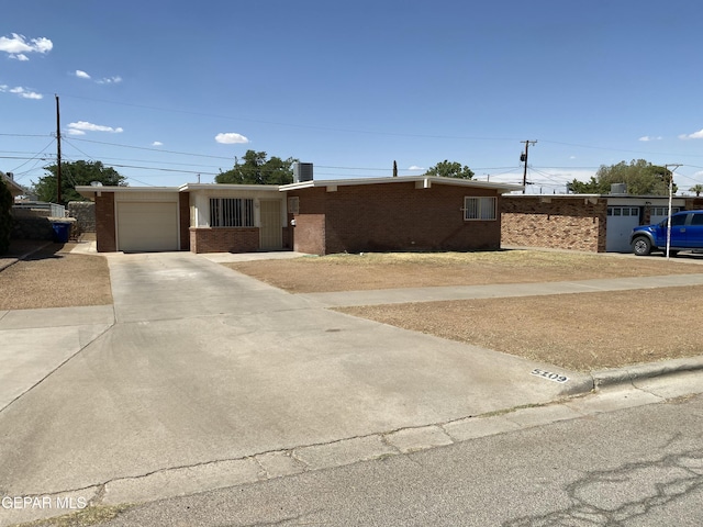5109 Yvette Ave, El Paso, TX 79924 - ranch-style home featuring brick siding, driveway, and a garage