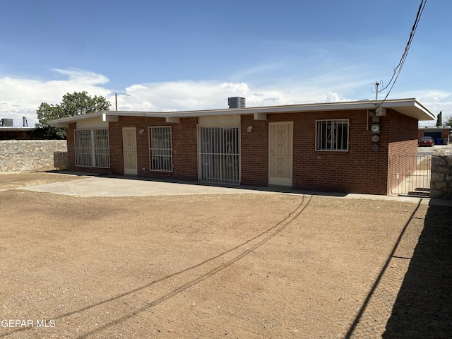 5109 Yvette Ave, El Paso, TX 79924 - ranch-style house with brick siding and a patio area