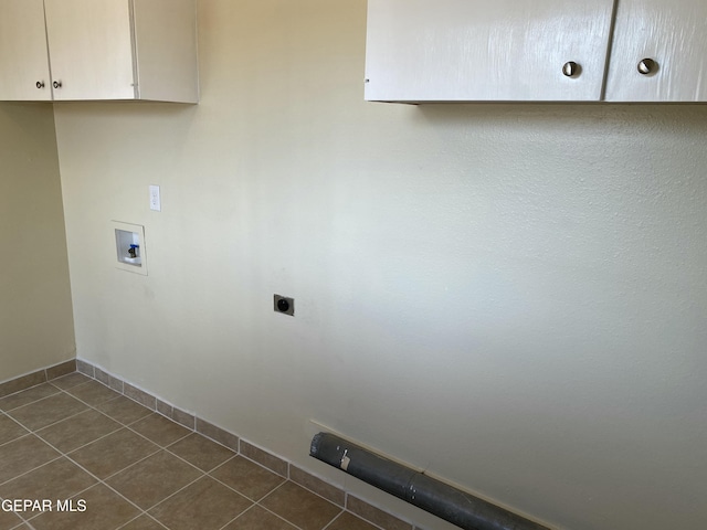 5109 Yvette Ave, El Paso, TX 79924 - washroom featuring cabinet space, dark tile patterned floors, hookup for an electric dryer, and washer hookup