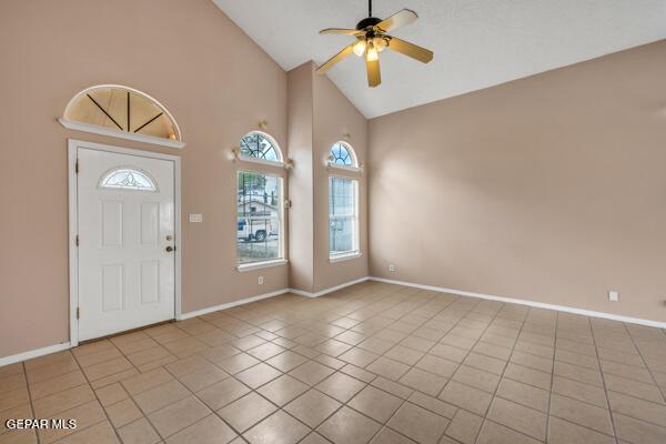 9813 La Morenita Cir, El Paso, TX 79927 - foyer with high vaulted ceiling, a ceiling fan, and tile patterned flooring