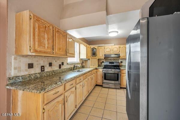 9813 La Morenita Cir, El Paso, TX 79927 - kitchen featuring appliances with stainless steel finishes, under cabinet range hood, tasteful backsplash, light tile patterned floors, and light brown cabinets