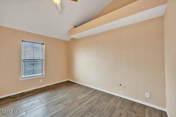 9813 La Morenita Cir, El Paso, TX 79927 - unfurnished room featuring lofted ceiling, wood finished floors, and ceiling fan