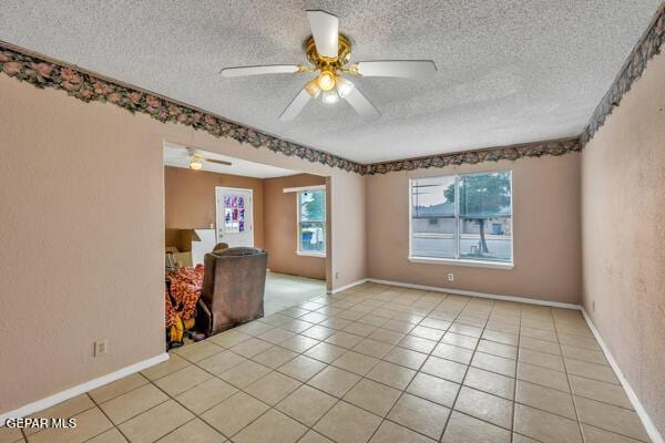 9813 La Morenita Cir, El Paso, TX 79927 - unfurnished room featuring a textured ceiling, a ceiling fan, and light tile patterned floors