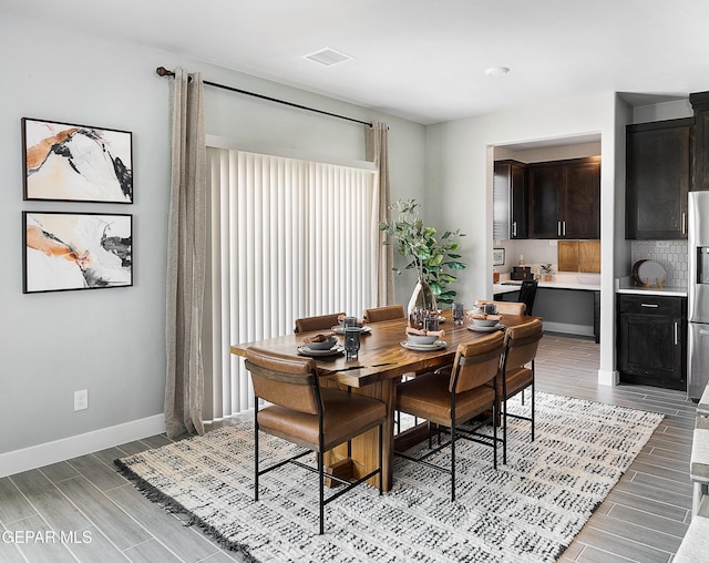 2241 Rocky Terrace Place, El Paso, TX 79911 - dining area with wood tiled floors and baseboards