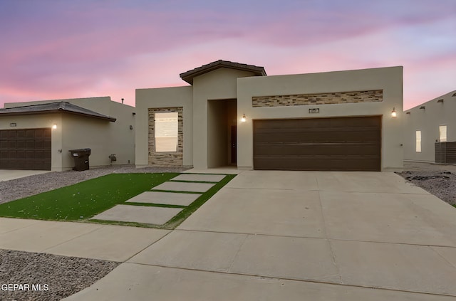 625 Paseo Dulce Ave, El Paso, TX 79928 - view of front facade with stucco siding, an attached garage, and driveway