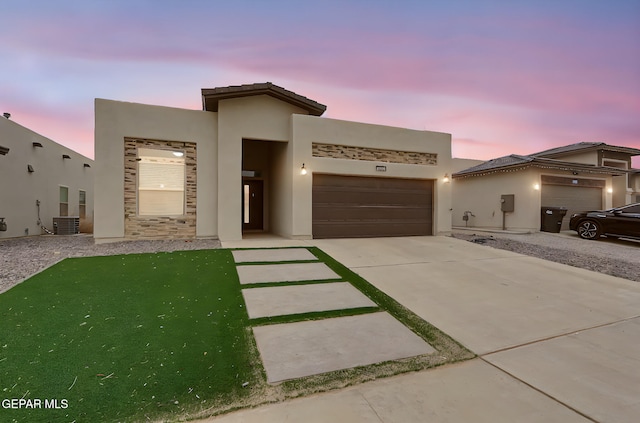 625 Paseo Dulce Ave, El Paso, TX 79928 - view of front of house featuring an attached garage, driveway, and stucco siding