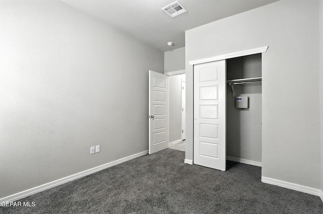 625 Paseo Dulce Ave, El Paso, TX 79928 - unfurnished bedroom featuring dark carpet and a closet