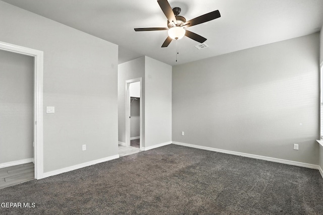 625 Paseo Dulce Ave, El Paso, TX 79928 - unfurnished bedroom featuring dark colored carpet, ceiling fan, and a spacious closet