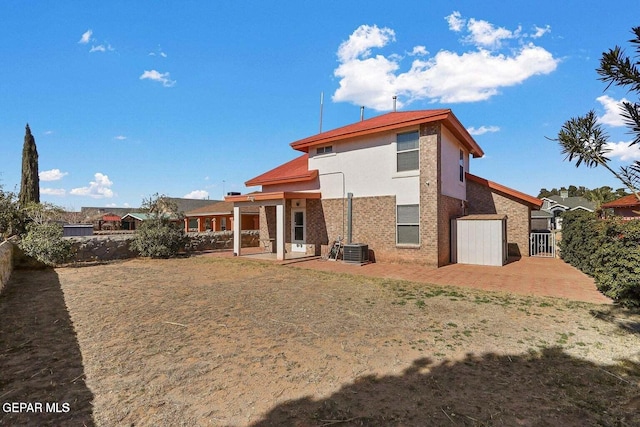 12232 Tierra Rosa Way, El Paso, TX 79938 - rear view of property featuring a patio, a fenced backyard, stucco siding, and brick siding