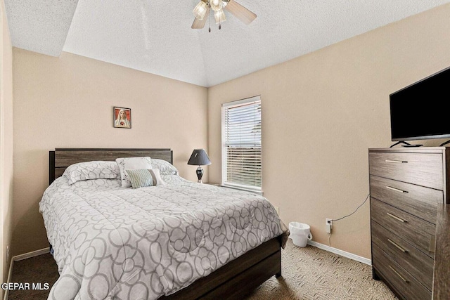 12232 Tierra Rosa Way, El Paso, TX 79938 - bedroom with carpet flooring, a textured ceiling, ceiling fan, and vaulted ceiling