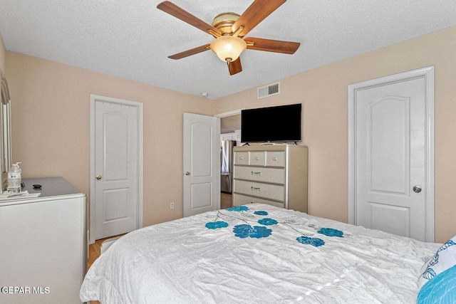 12232 Tierra Rosa Way, El Paso, TX 79938 - bedroom with a textured ceiling and ceiling fan