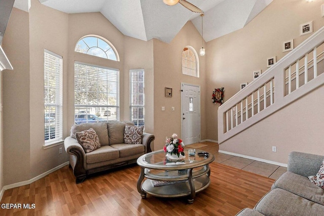 12232 Tierra Rosa Way, El Paso, TX 79938 - living room with stairs, high vaulted ceiling, and wood finished floors