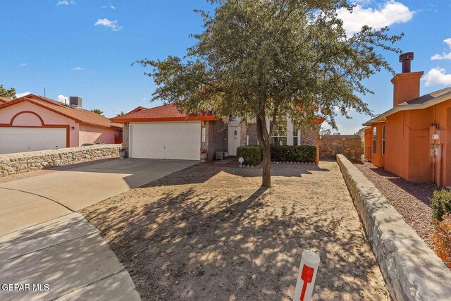 12232 Tierra Rosa Way, El Paso, TX 79938 - view of front of home featuring a garage and driveway