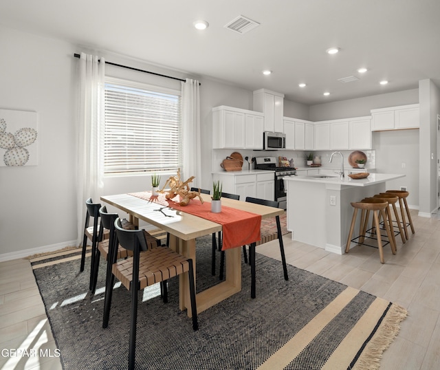13973 Summer Hail Ave, El Paso, TX 79928 - dining space featuring light wood-type flooring and recessed lighting