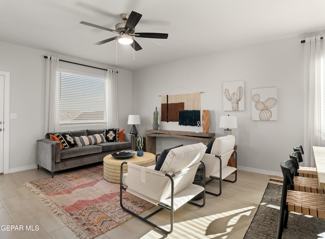 13973 Summer Hail Ave, El Paso, TX 79928 - living room with wood finished floors and a ceiling fan