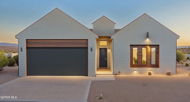 812 Acton St, El Paso, TX 79928 - contemporary house featuring concrete driveway and an attached garage