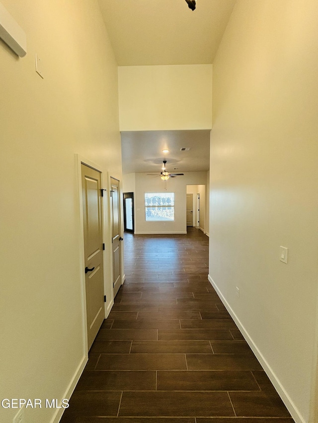 812 Acton St, El Paso, TX 79928 - hallway featuring dark wood finished floors and a towering ceiling