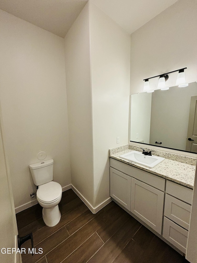 812 Acton St, El Paso, TX 79928 - bathroom with wood finished floors and vanity