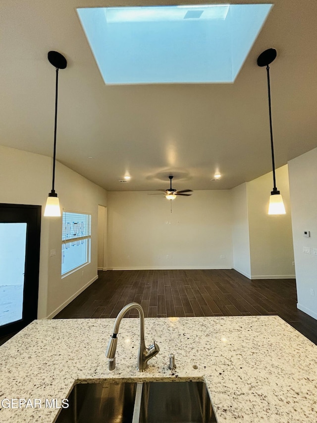 812 Acton St, El Paso, TX 79928 - kitchen featuring dark wood-style floors, pendant lighting, and a ceiling fan