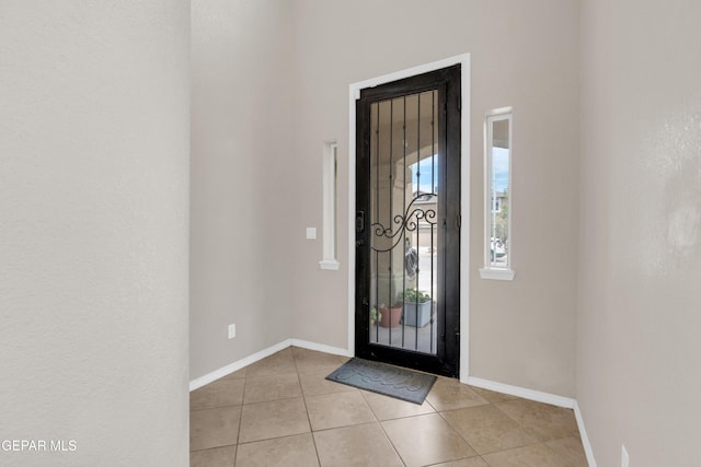 10925 Ray Mena Ln, El Paso, TX 79934 - foyer with light tile patterned flooring and baseboards