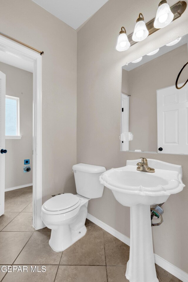 10925 Ray Mena Ln, El Paso, TX 79934 - bathroom with toilet and tile patterned floors