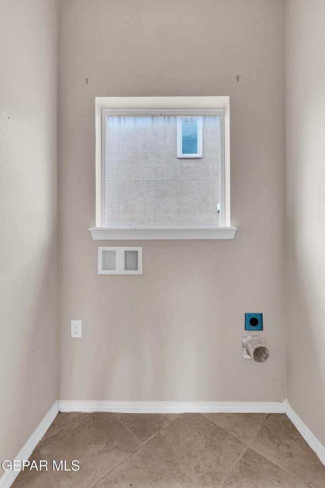 10925 Ray Mena Ln, El Paso, TX 79934 - washroom featuring electric dryer hookup, hookup for a washing machine, and tile patterned flooring