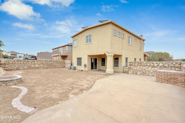 10925 Ray Mena Ln, El Paso, TX 79934 - back of house with a patio, a fenced backyard, and stucco siding