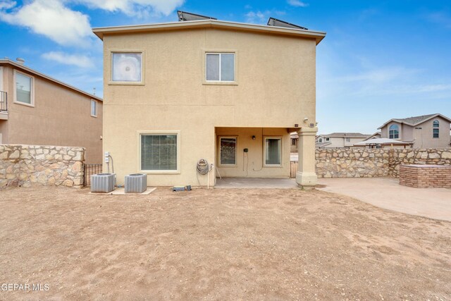 10925 Ray Mena Ln, El Paso, TX 79934 - rear view of property with stucco siding and a patio