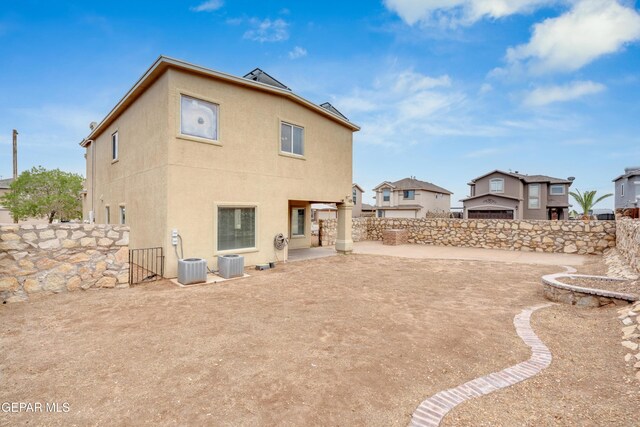10925 Ray Mena Ln, El Paso, TX 79934 - back of property with stucco siding and a gate