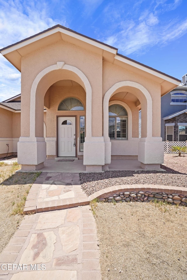 13788 Paseo Verde Dr, El Paso, TX 79928 - property entrance featuring stucco siding and a porch