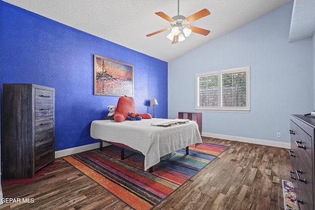 13788 Paseo Verde Dr, El Paso, TX 79928 - bedroom with dark wood-style floors, lofted ceiling, and ceiling fan