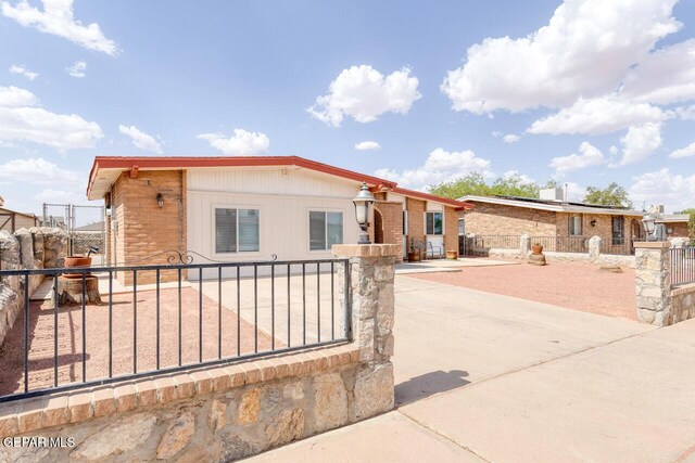 10636 Palomino St, El Paso, TX 79924 - view of front facade with a fenced front yard and a gate