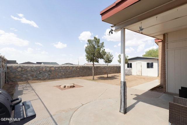 10636 Palomino St, El Paso, TX 79924 - fenced backyard with a patio area and a shed